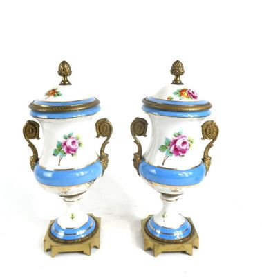 two blue and white vases with flowers on them