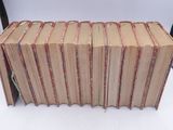 a lot of books stacked on top of each other
