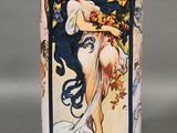 a vase that has a picture of a woman on it