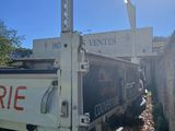 a truck that is parked next to a wall
