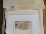 several pieces of white paper are stacked on top of a pallet