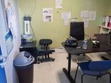 a room with a desk and a chair in it