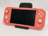 a pink nintendo wii game console with a black screen