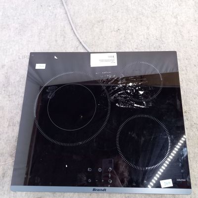 a black stove top with two burners on it