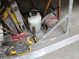 a lot of tools that are sitting on the floor