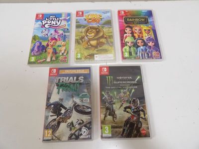four nintendo wii games on a table with a white background