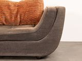 an image of a couch with a pillow on top of it