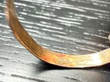 a close up of a ring on a wooden table