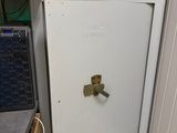 a white refrigerator with a door open in a room