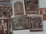 a lot of old photos on the wall of a room