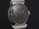 a close up of a watch with a black face