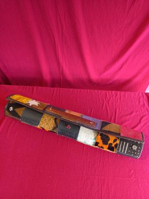 a knife that is laying on top of a pink cloth