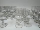 a lot of empty wine glasses sitting on a table