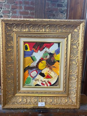 gold framed painting of a vase of flowers on a wooden table