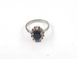 a close up of a ring on a white surface