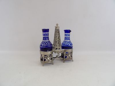 two blue vases sitting next to each other on a table