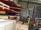 a large warehouse filled with lots of different types of pipes