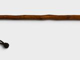 an image of a wooden stick with a black handle