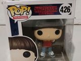 a close up of a pop vinyl figure in a box