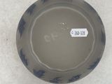 a blue and white bowl sitting on a white surface