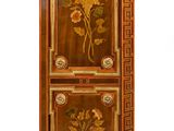 a wooden cabinet with a floral design on it
