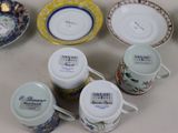 several cups and saucers are lined up on a table