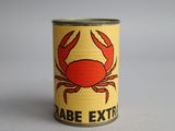 an image of a can with a crab on it sitting on a table