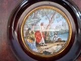 a plate with a picture of a woman and a dog on it