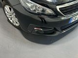 the black car is parked in the showroom of a car showroom