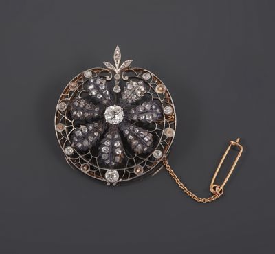 an antique diamond and gold broochle