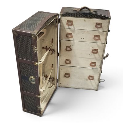 an old suitcase with many drawers inside of it
