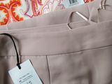 a close up of a pair of pants with a tag on it