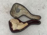 two pipe holders that are sitting on a table