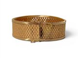 an image of a gold bracelet on a white background
