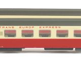 a toy train that is sitting on a white surface