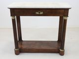 a small table with a marble top on a white floor