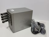 an image of a silver box with a bunch of cables on top of it
