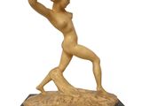 une image représentant une statue d'une femme tenant une raquette de tennis