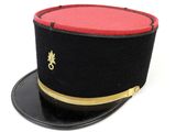 a black hat with a red top and gold trim