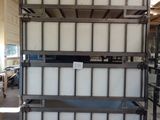a large stack of containers sitting in a warehouse