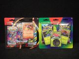 two packs of pokemon trading cards on a black background