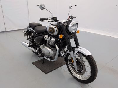 a black and white motorcycle parked in a garage
