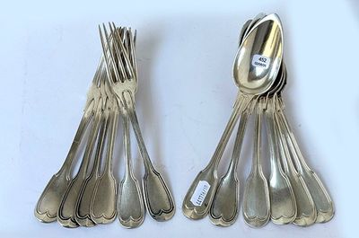 a lot of silver spoons and spoon spoons on the table