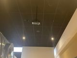 a ceiling fan that is hanging from the ceiling in a building