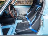 a blue car with black seats and a steering wheel