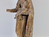 an image of a statue of a woman holding a baby