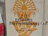 a sign that says 20 estampes pecombienes in french on a table
