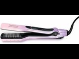 a close up of a hair straightener on a white surface