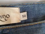 the back of a pair of blue jeans with a tag on it