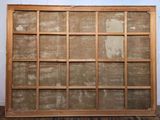 an old wooden frame with a window on the wall